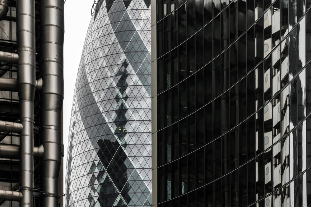 LONDON, UK - 8 MARCH 2015: Abstract architectural detail of key City of London financial landmarks including the iconic Gherkin building (centre) and Lloyds Building (left).